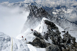 Climbers moving from the South Summit to the Hillary Step on upper Everest